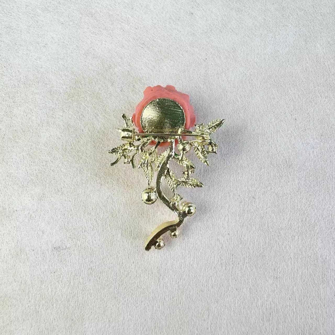 Detailed view of floral brooch with pearls on a dark background
