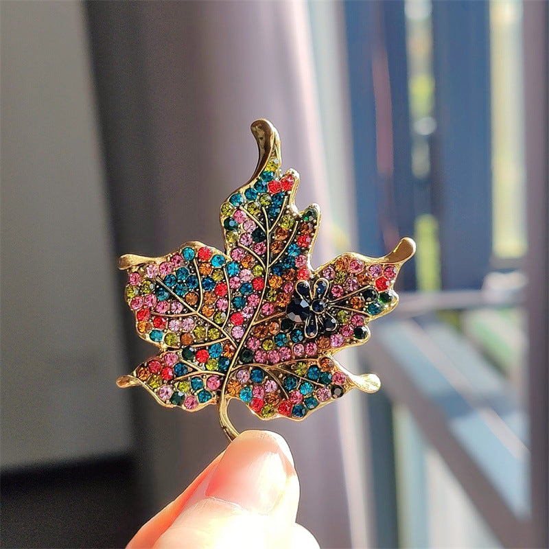 Detailed view of colorful crystals on brooch - image 3