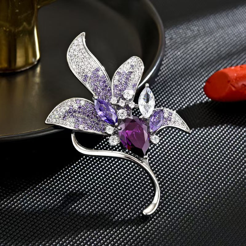 Purple floral pin with intricate details displayed elegantly