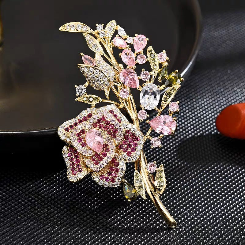 Pink rose bouquet brooch on jacket