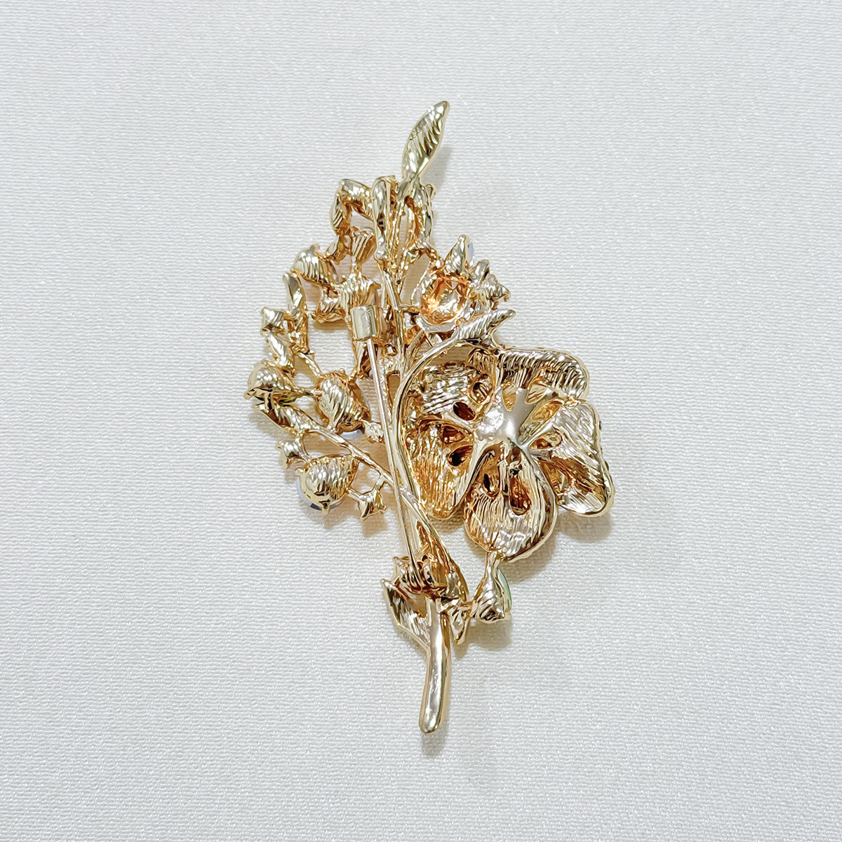 Close-up of floral brooch details