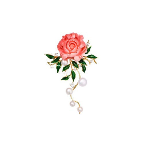 Close up of pearl embellished floral brooch on a model