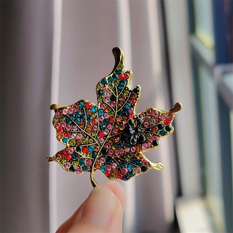 Stylish vintage leaf brooch with colorful crystals - image 1