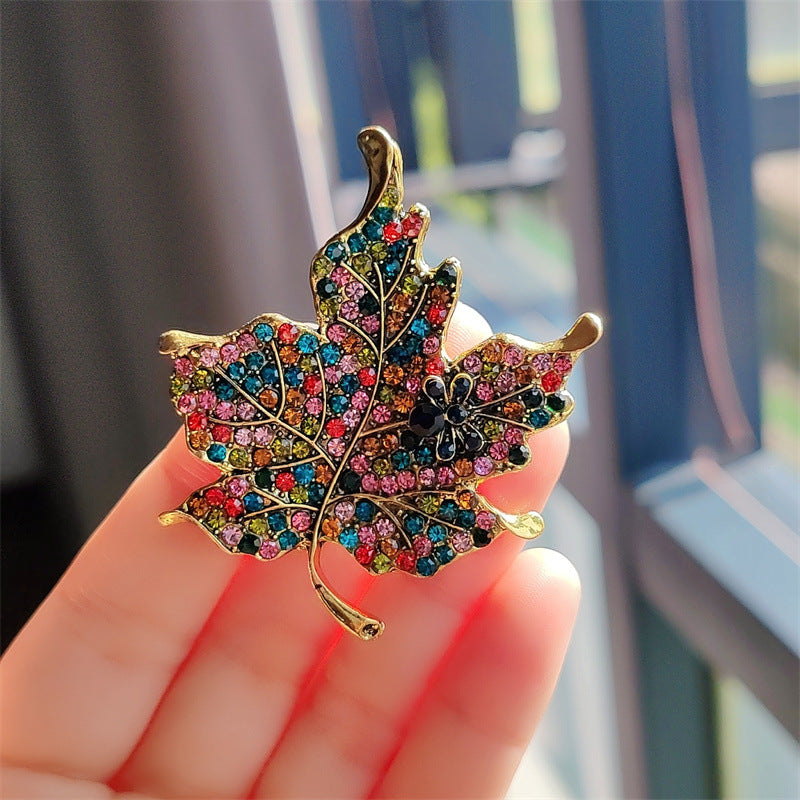 Stylish vintage leaf brooch with colorful crystals - image 1