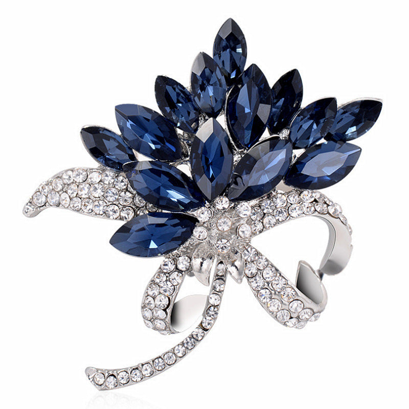 close-up of fashion brooch with rhinestones and floral design