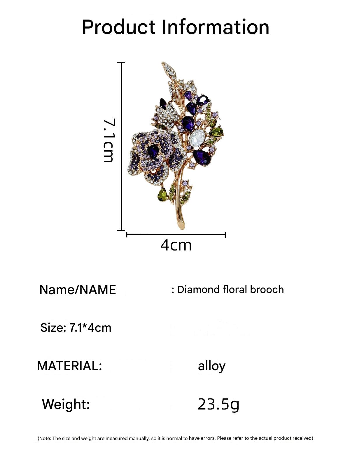 Purple rose brooch displayed on fabric