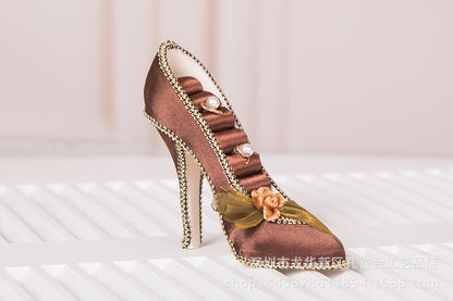 elegant silver patterned high heel jewelry display