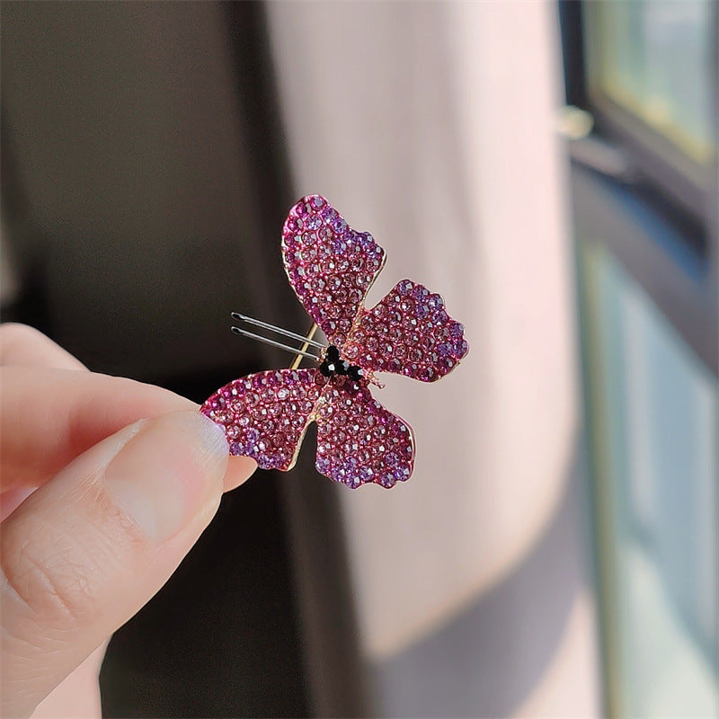 Butterfly Brooch side view showing rhinestone details