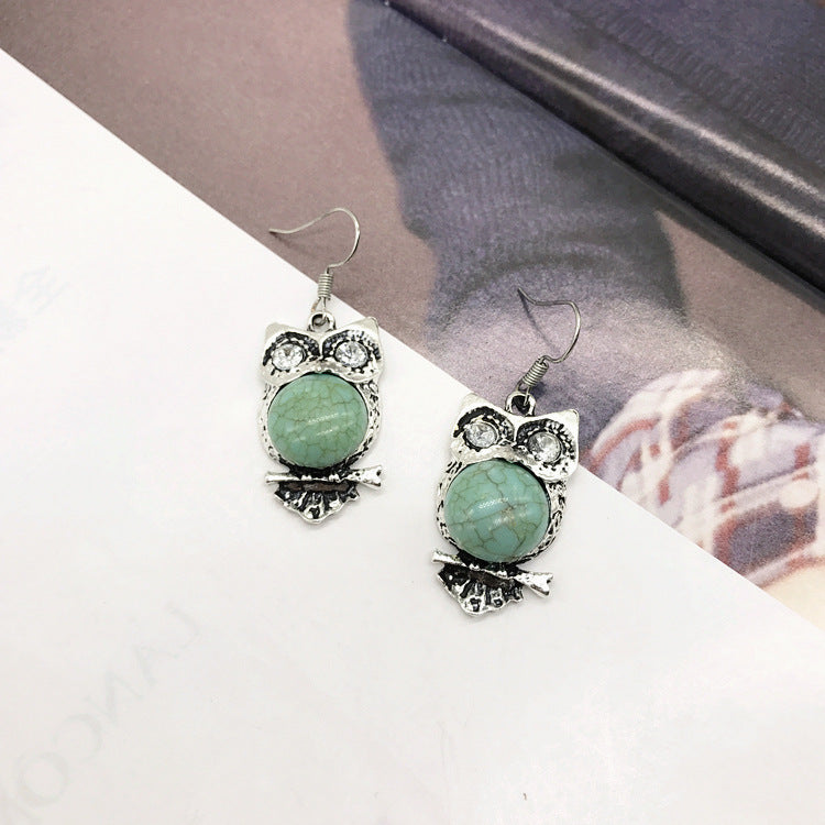 Close-up of turquoise earrings in vintage design - image 2