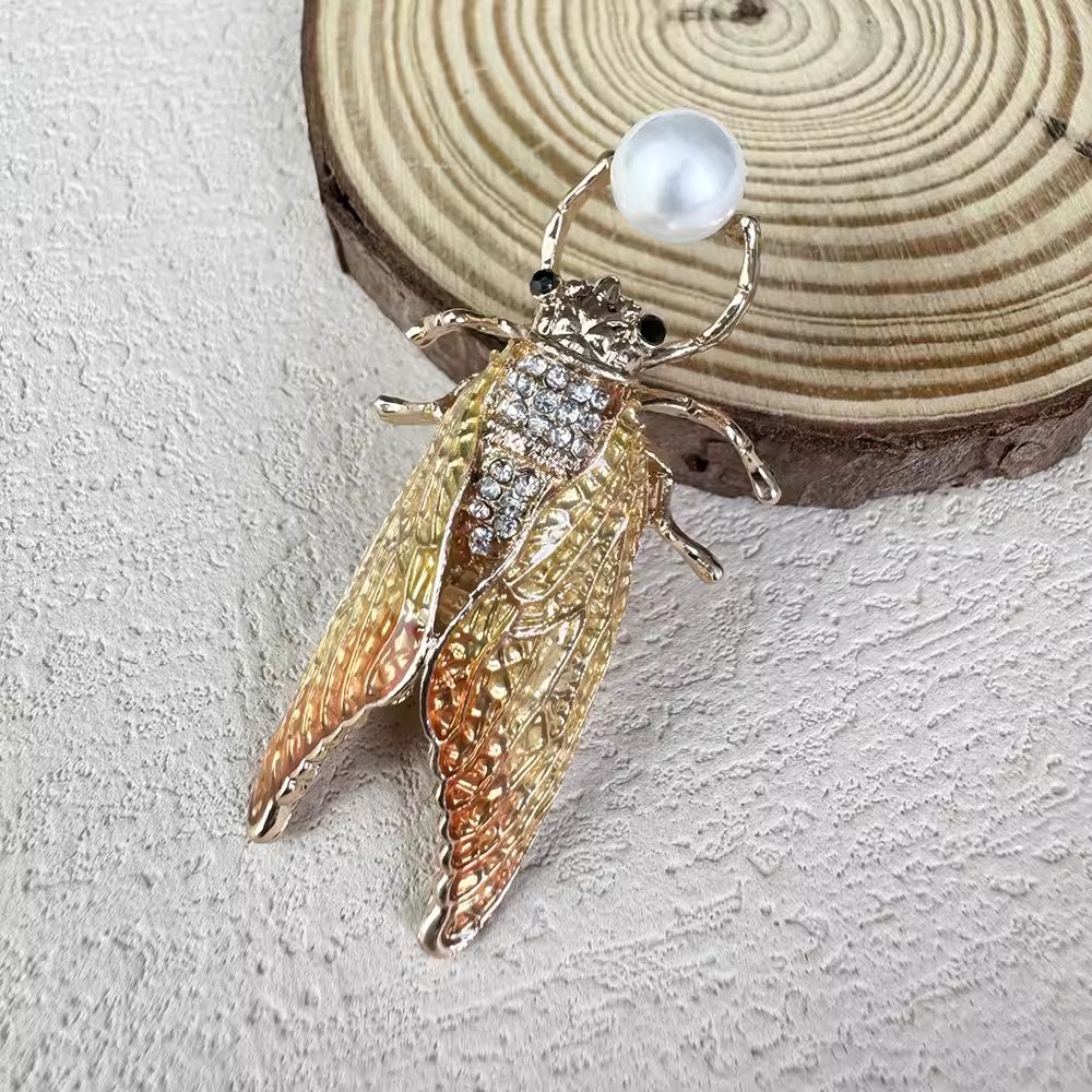 Brightly colored cicada brooch for gifting