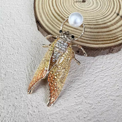 Brightly colored cicada brooch for gifting