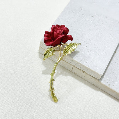 Close-up of Elegant Red Rose Brooch details