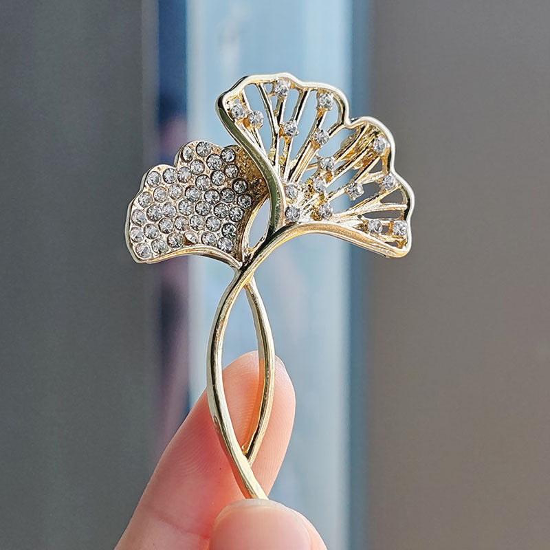 Elegant Ginkgo Leaf Brooch with crystals on a black jacket