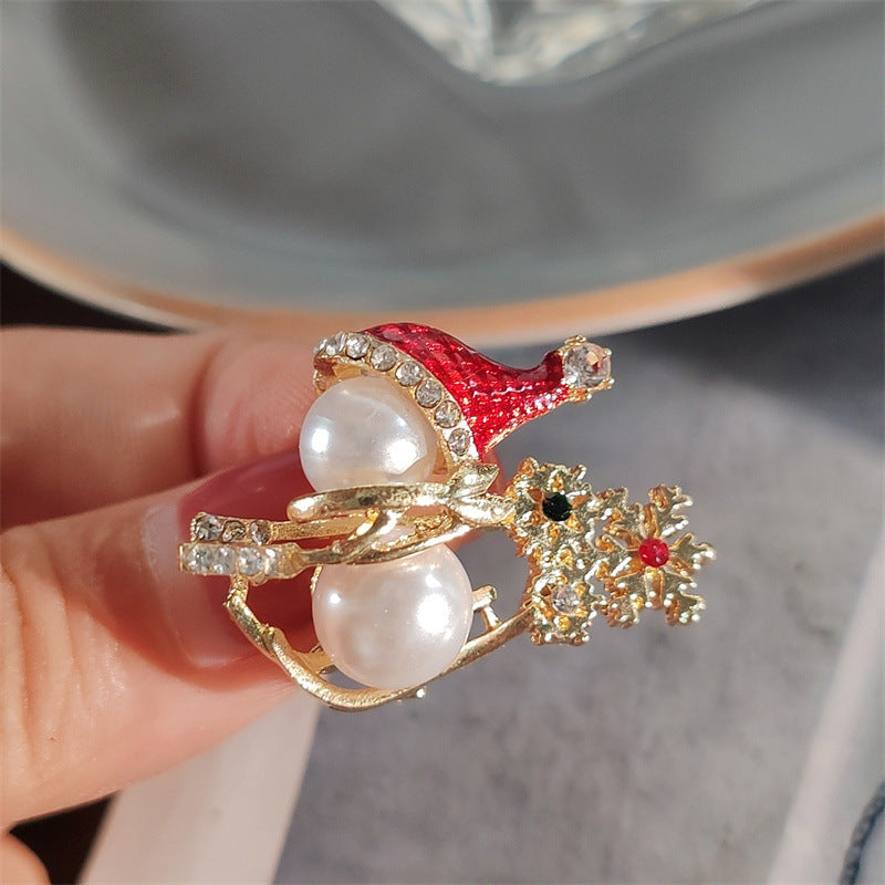 Stylish snowman brooch on sweater