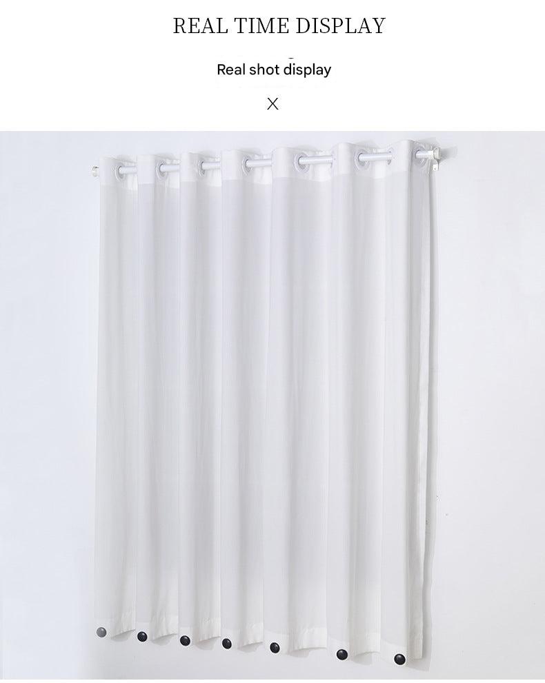 Magnetic hooks securing tablecloth in wind