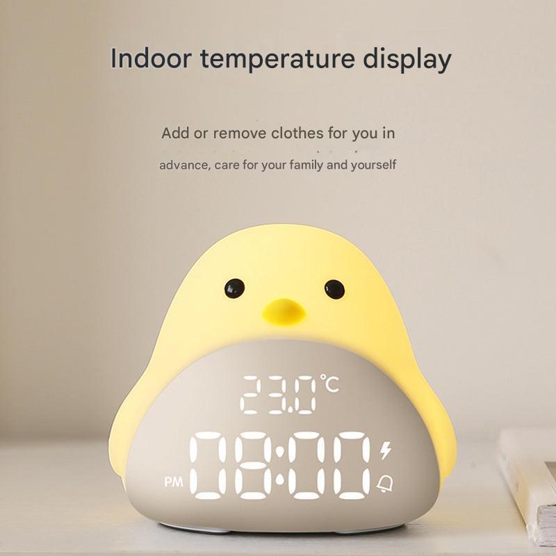 white bird-shaped alarm clock with LED on nightstand