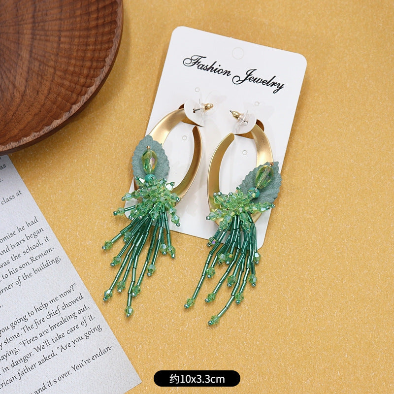 Colorful floral earrings displayed on white background image 3
