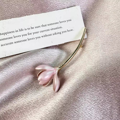 Elegant floral pin with soft pink colors