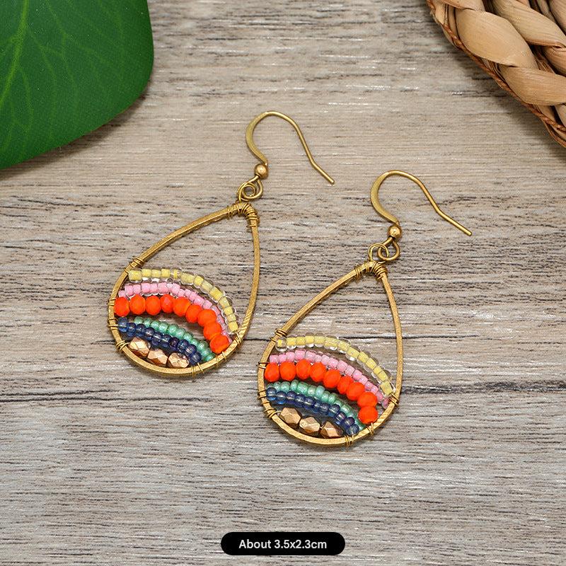 Close-up of women wearing unique tassel earrings