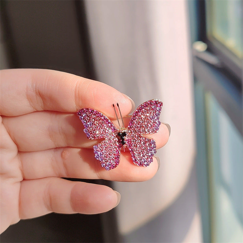 Brooch worn on a coat showing styling options