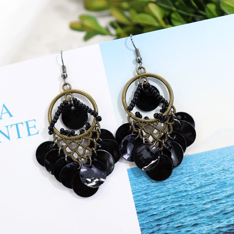 Elegant mother-of-pearl earrings on model
