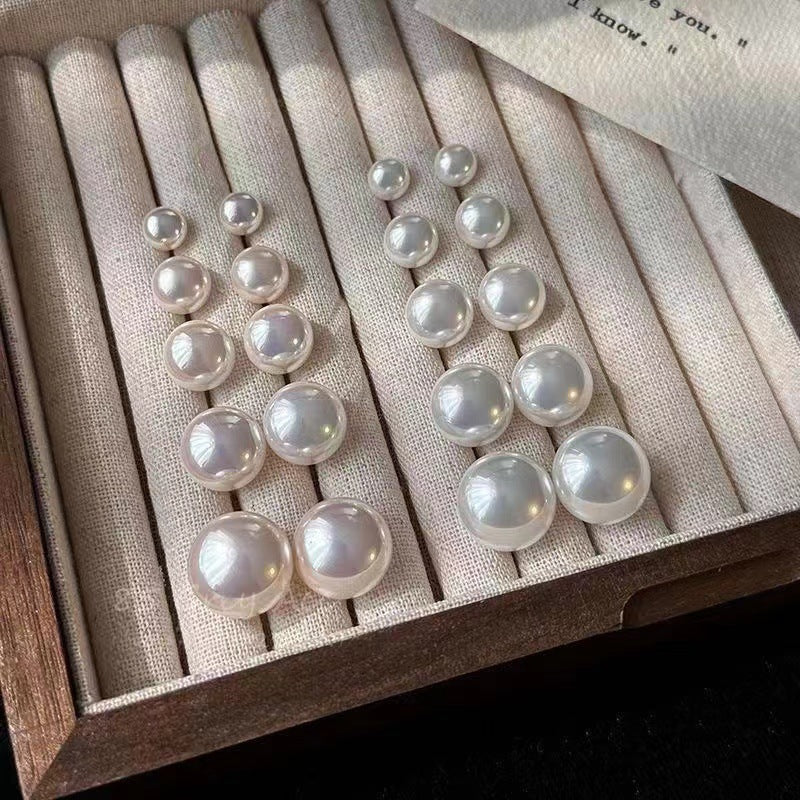 Close-up view of Pearl Stud Earrings - Image 3