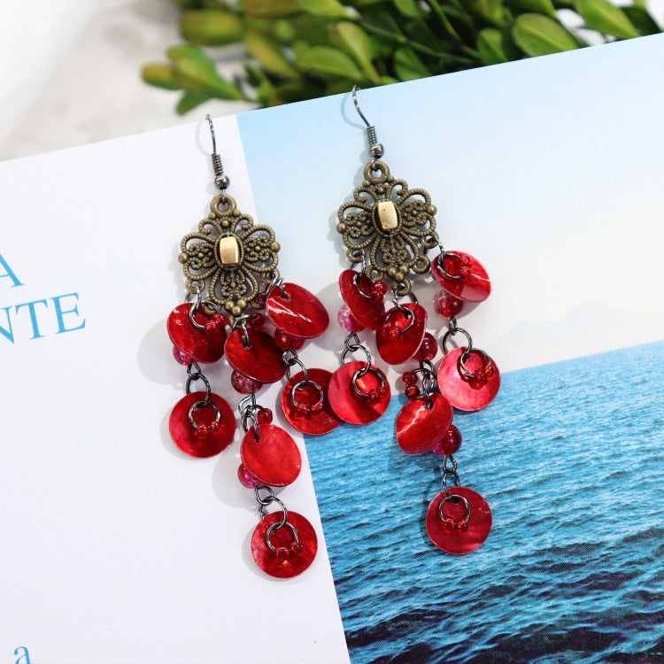 Elegant mother-of-pearl earrings on model