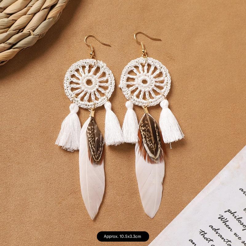 Different style variations of feather earrings