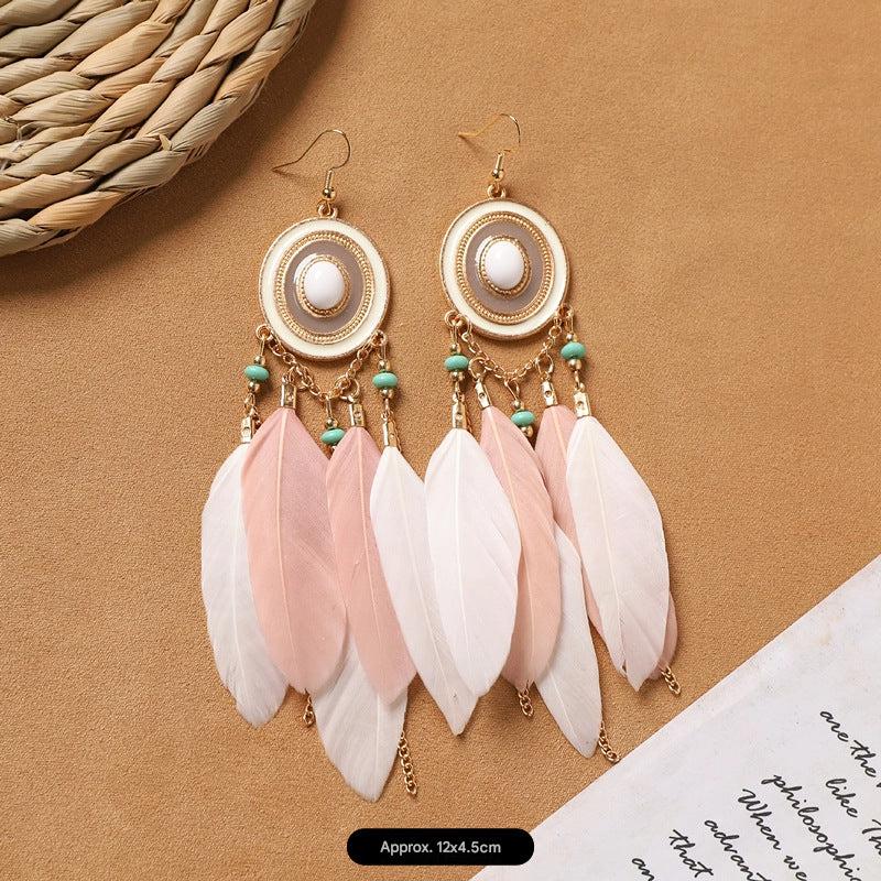 Feather tassel earrings on model