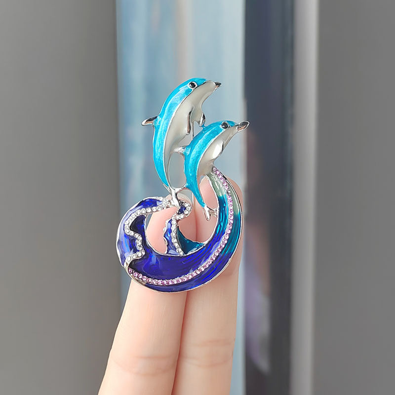 Stylish dolphin brooch design on jacket