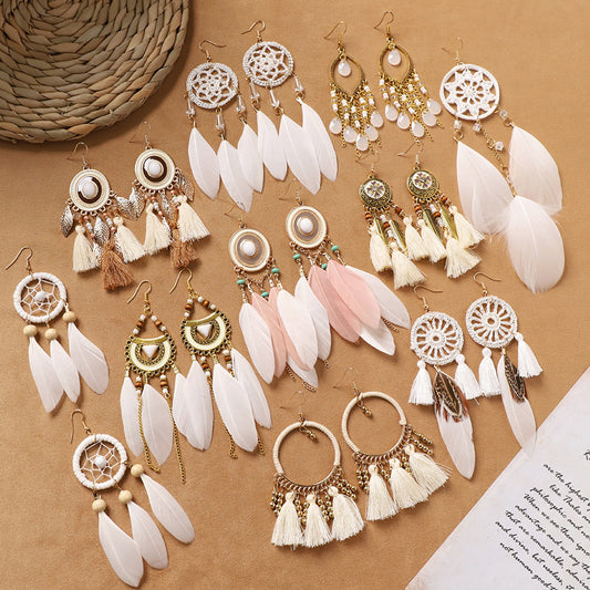 Feather tassel earrings on model