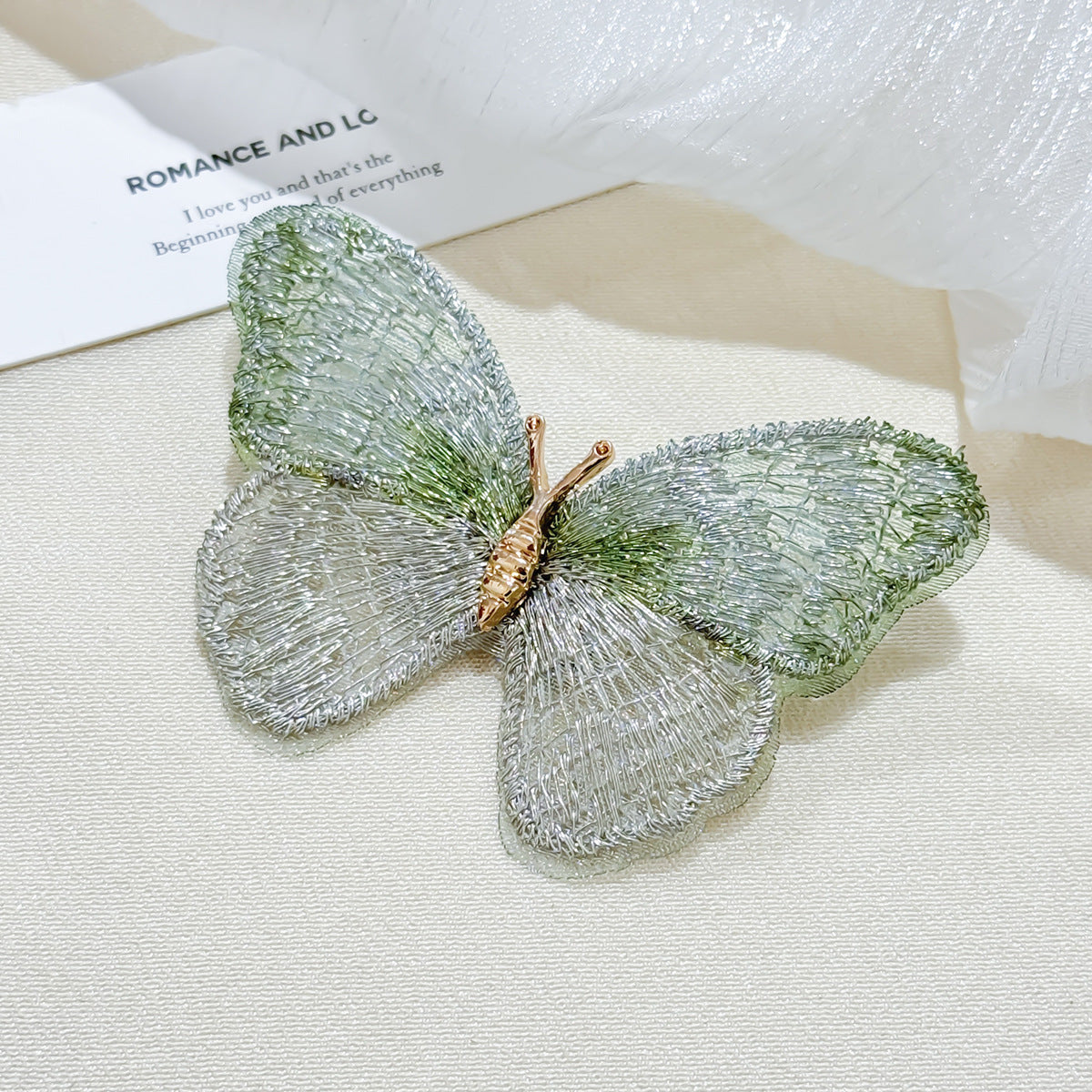 Embroidered butterfly brooch front view