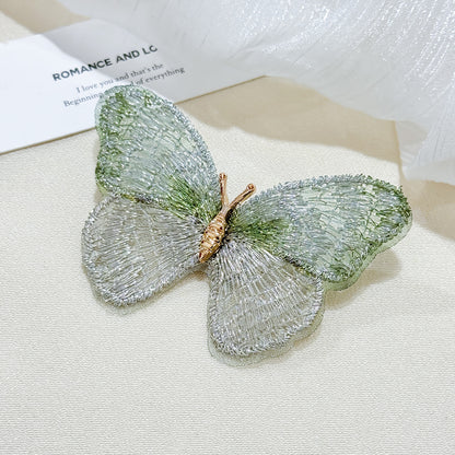 Embroidered butterfly brooch front view