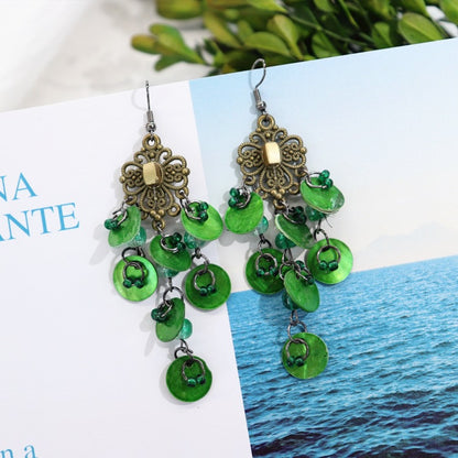 Casual outfit with shell earrings showcased