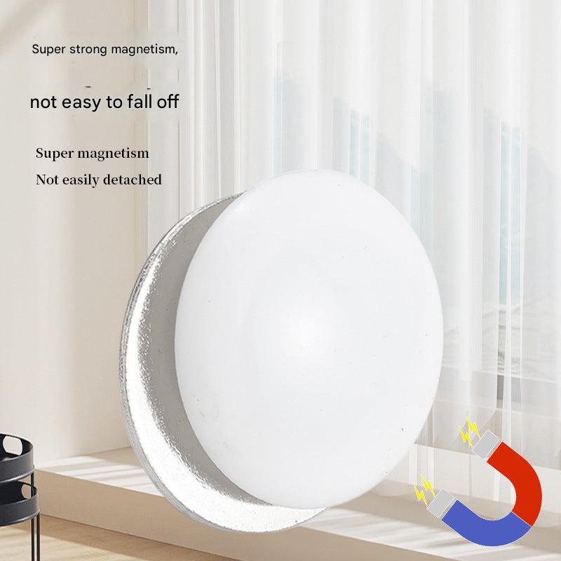 Magnetic curtain weight hanging on curtain