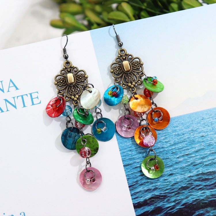 Casual outfit with shell earrings showcased