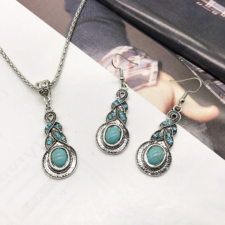 Flat lay display of necklace and earrings with turquoise details - image 6