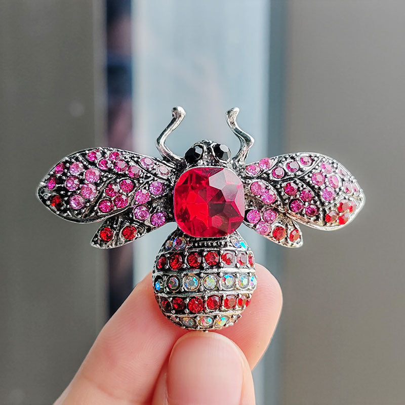 Close-up of the bee brooch detailing