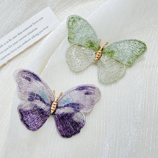 Colorful butterfly brooch on display