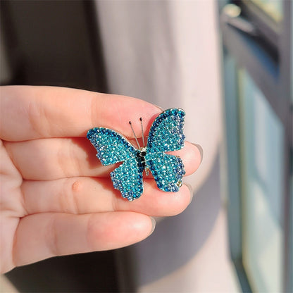 Close-up of the butterfly design on the brooch