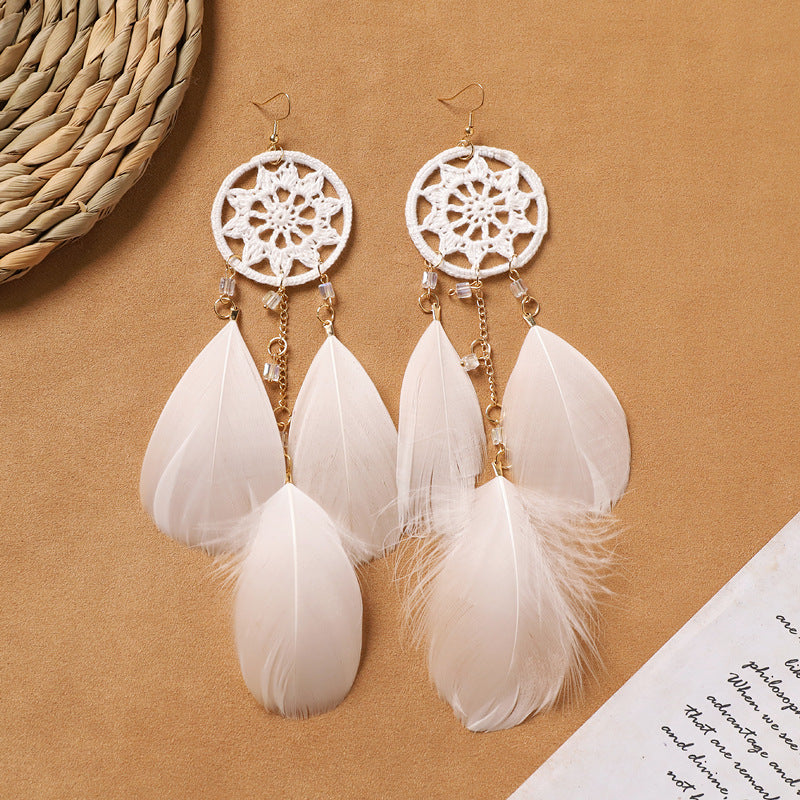 Different style variations of feather earrings