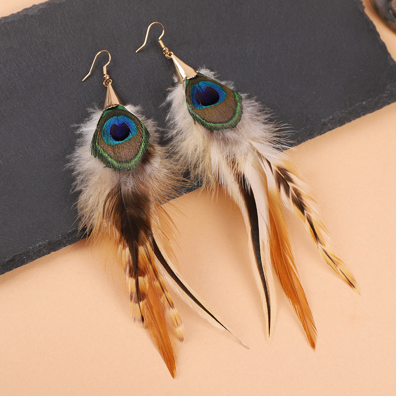 Colorful long feather earrings on a mannequin