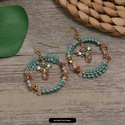 Colorful ethnic earrings displayed elegantly image 4
