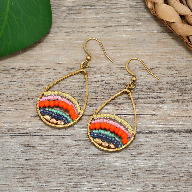 Elegant tassel earrings against a sunny background