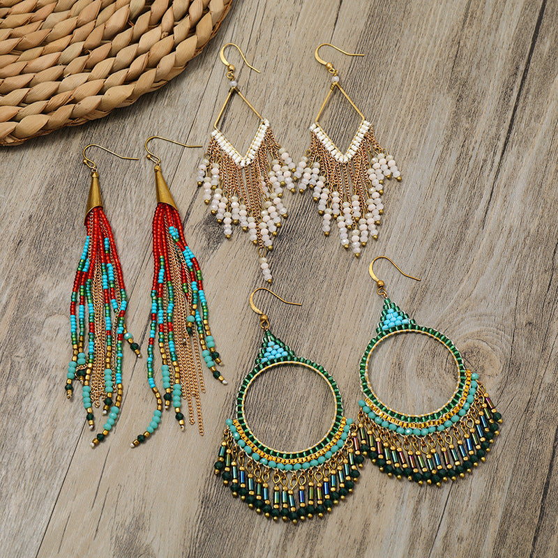 Wearing bohemian tassel earrings outdoors image 5