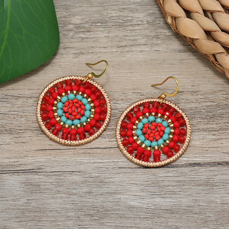 Close-up of women wearing unique tassel earrings