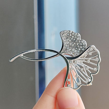 Elegant Ginkgo Leaf Brooch with crystals on a black jacket