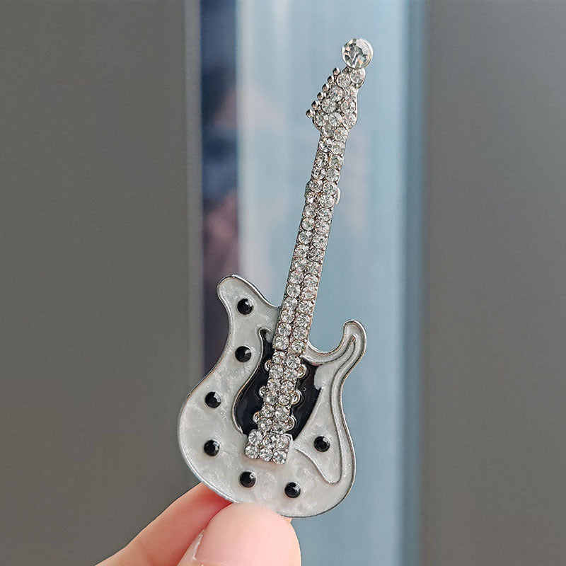 Close-up of guitar brooch with rhinestones image 2