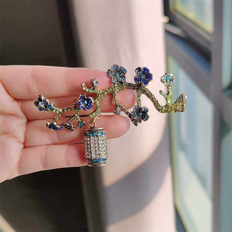 Floral brooch with rhinestones on display