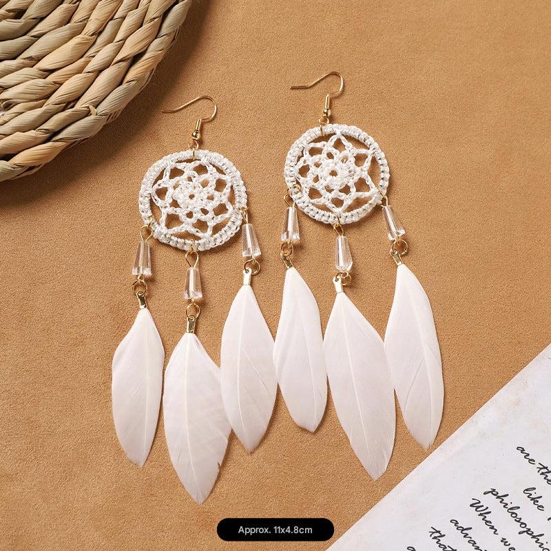 Feather tassel earrings on model